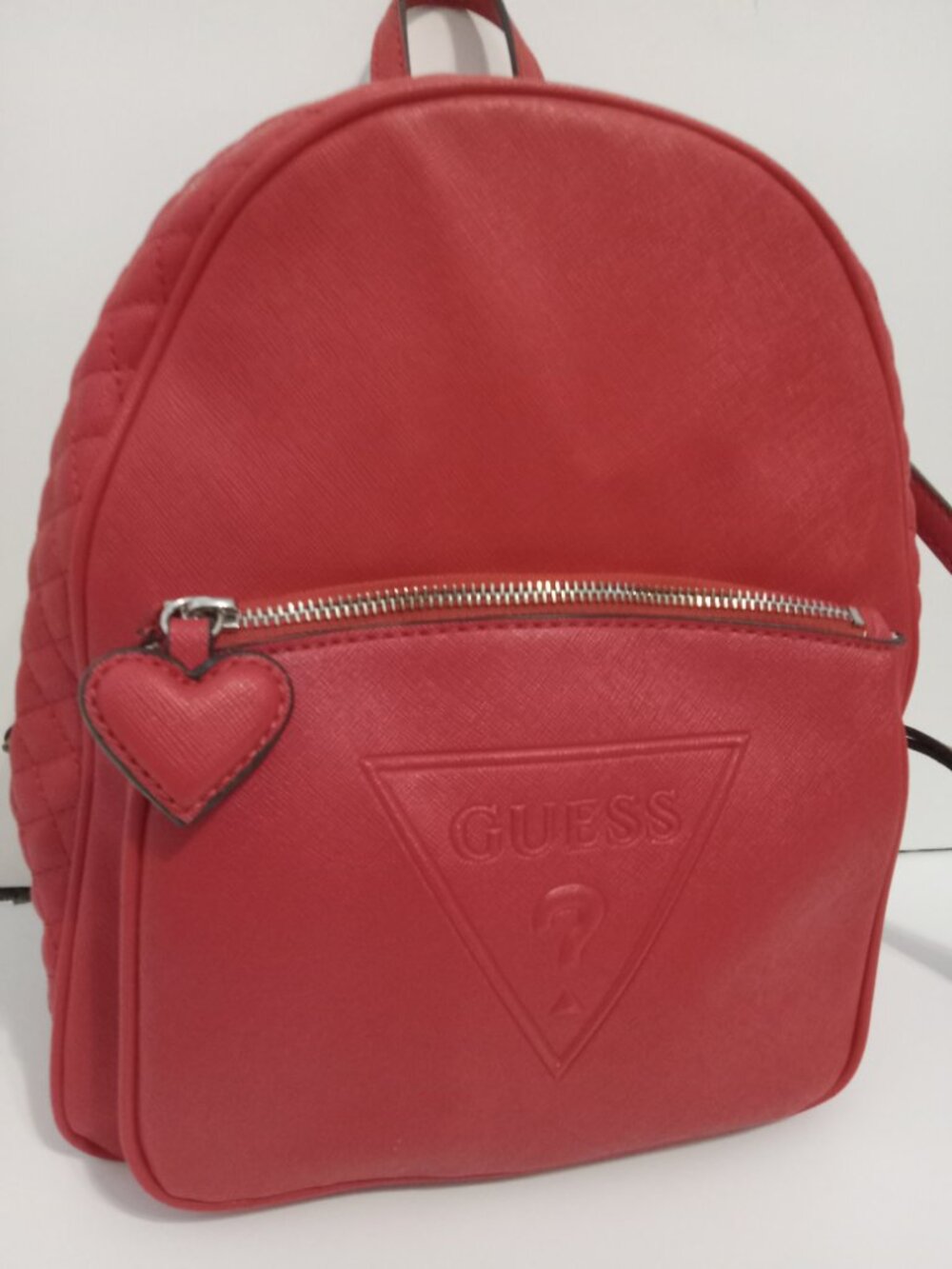 Red backpack purse with heart zipper by Guess brand